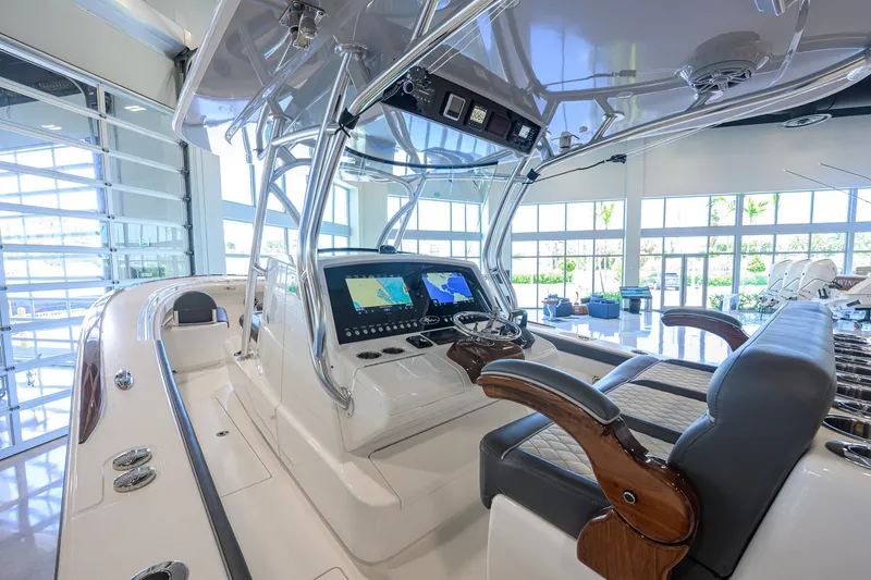 Slide: The Image of 2023 Valhalla Boatworks V-33 interior with advanced navigation system and luxurious seating. - 8