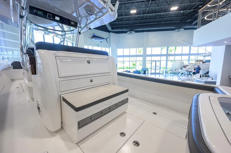 Slide: The Image of 2023 Valhalla Boatworks V-33 interior with seating and storage in showroom. - 38