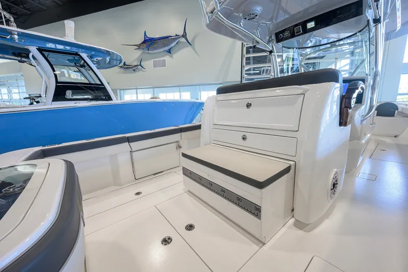 Slide: The Image of 2023 Valhalla Boatworks V-33 interior with seating and storage, displayed indoors. - 33