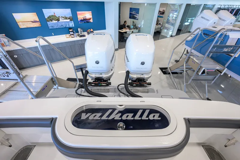 Slide: The Image of 2023 Valhalla Boatworks V-33 with twin outboard engines in showroom display. - 56
