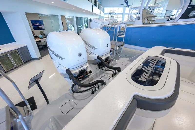 Slide: The Image of 2023 Valhalla Boatworks V-33 with dual Mercury outboard engines in showroom. - 58