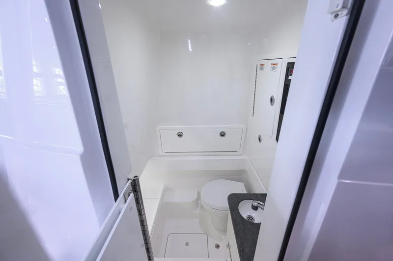 Slide: The Image of 2023 Valhalla Boatworks V-33 interior bathroom with modern fixtures and sleek design. - 40