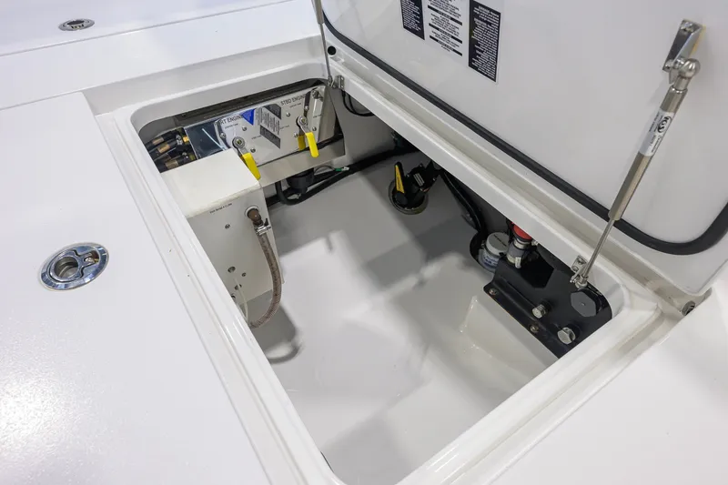 Slide: The Image of 2023 Valhalla Boatworks V-33 engine compartment showcasing internal components and storage. - 54