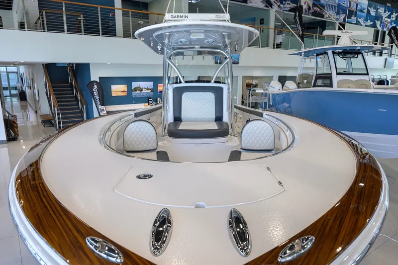 Slide: The Image of 2023 Valhalla Boatworks V-33 interior with elegant seating and modern design in showroom. - 19