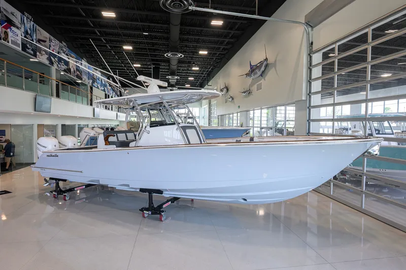 Slide: The Image of 2023 Valhalla Boatworks V-33 displayed indoors, showcasing sleek design and modern features. - 2