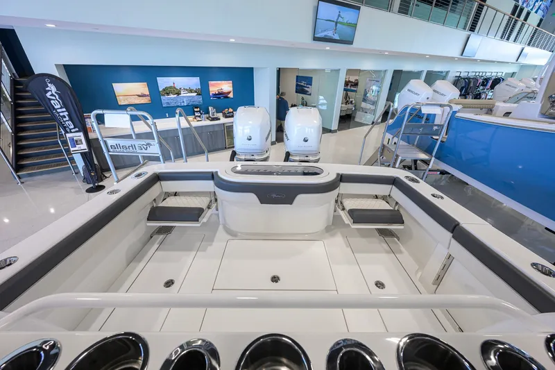 Slide: The Image of 2023 Valhalla Boatworks V-33 displayed in a modern showroom setting. - 30