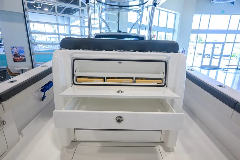 Slide: The Image of 2023 Valhalla Boatworks V-33 interior storage compartments in a showroom setting. - 36