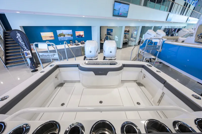 Slide: The Image of 2023 Valhalla Boatworks V-33 interior at a showroom with twin engines. - 29