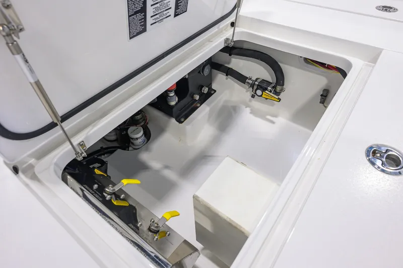 Slide: The Image of 2023 Valhalla Boatworks V-33 storage compartment with mechanical components and valves. - 53