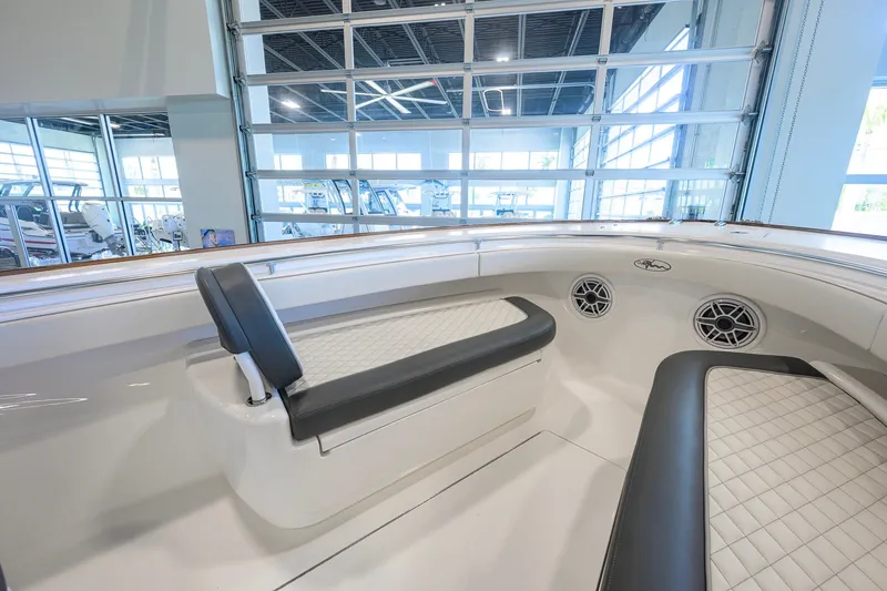 Slide: The Image of 2023 Valhalla Boatworks V-33 interior with cushioned seating and modern design. - 23