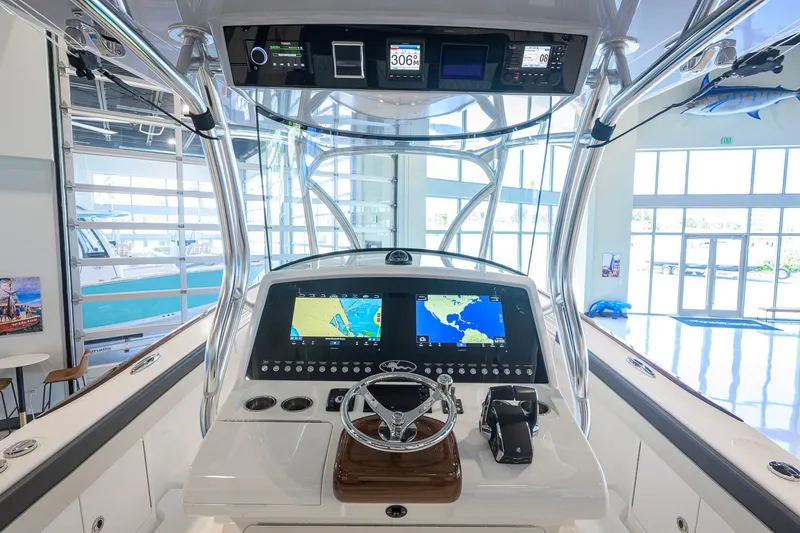 Slide: The Image of 2023 Valhalla Boatworks V-33 helm with advanced navigation displays and controls. - 10