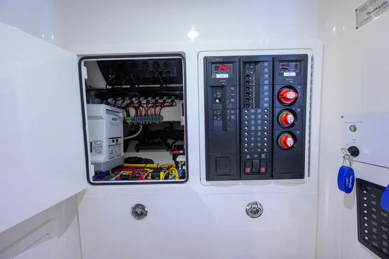 Slide: The Image of Electrical panel of 2023 Valhalla Boatworks V-33, showcasing wiring and control systems. - 43