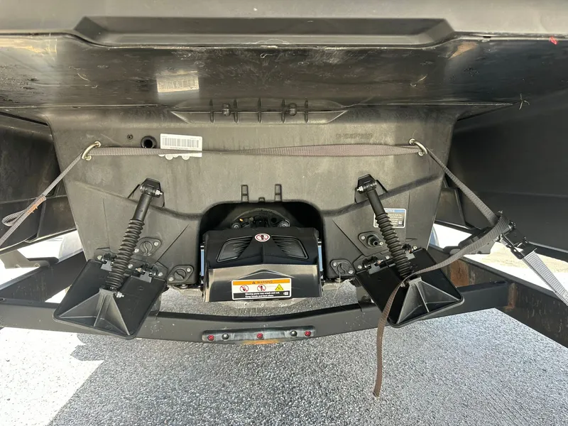 Slide: The Image of Underside of a Sea-Doo 21 SWITCH SPORT with shock absorbers and trailer hitch. - 13