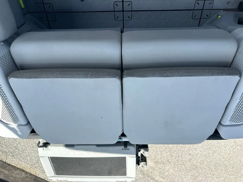 Slide: The Image of Rear view of two gray boat seats with mesh pockets on the sides. - 16