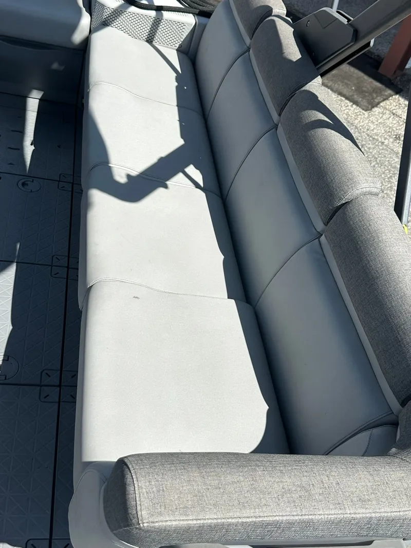Slide: The Image of Gray seating bench on a boat with textured flooring. - 17