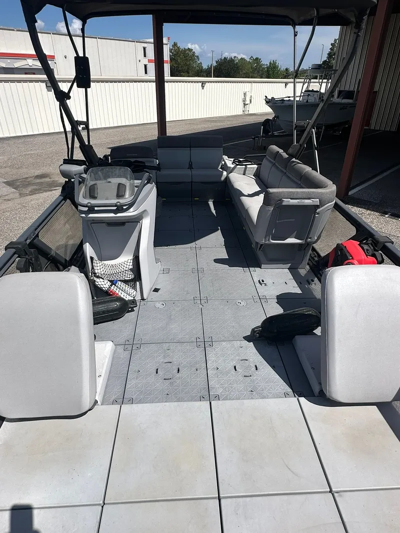 Slide: The Image of Interior view of a 2023 Sea-Doo 21 SWITCH SPORT with gray seating and open deck. - 18