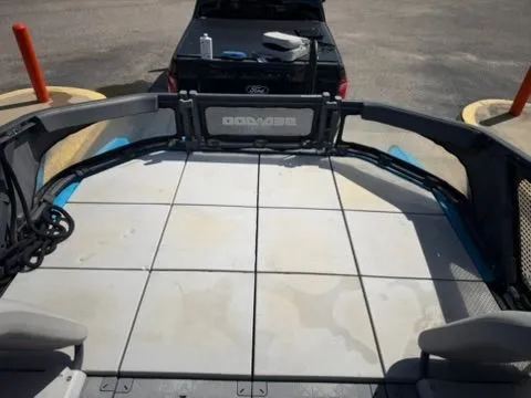 Slide: The Image of View from a Sea-Doo 21 Switch Cruise onto a parking lot with a car in the background. - 26