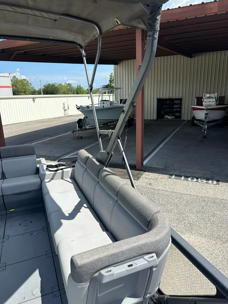 Slide: The Image of The image shows the interior of a 2023 Sea-Doo 21 SWITCH SPORT with gray seating. - 28