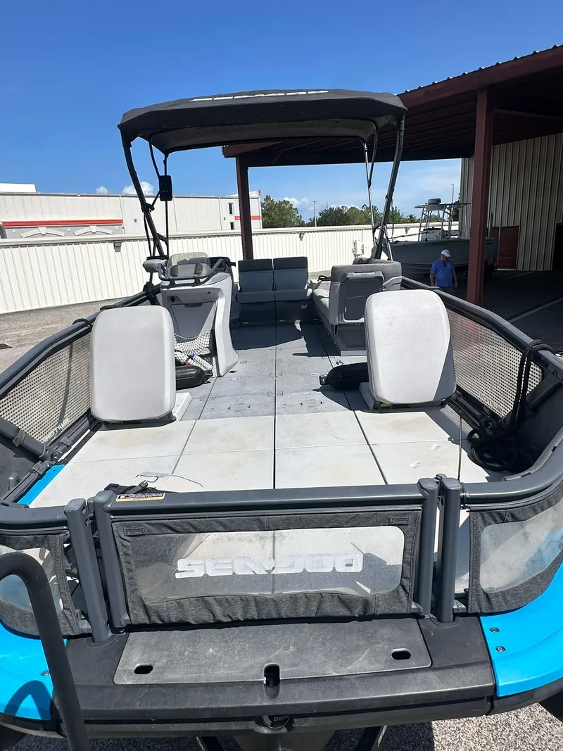 Slide: The Image of A 2023 Sea-Doo 21 SWITCH SPORT with a spacious deck and seating. - 31