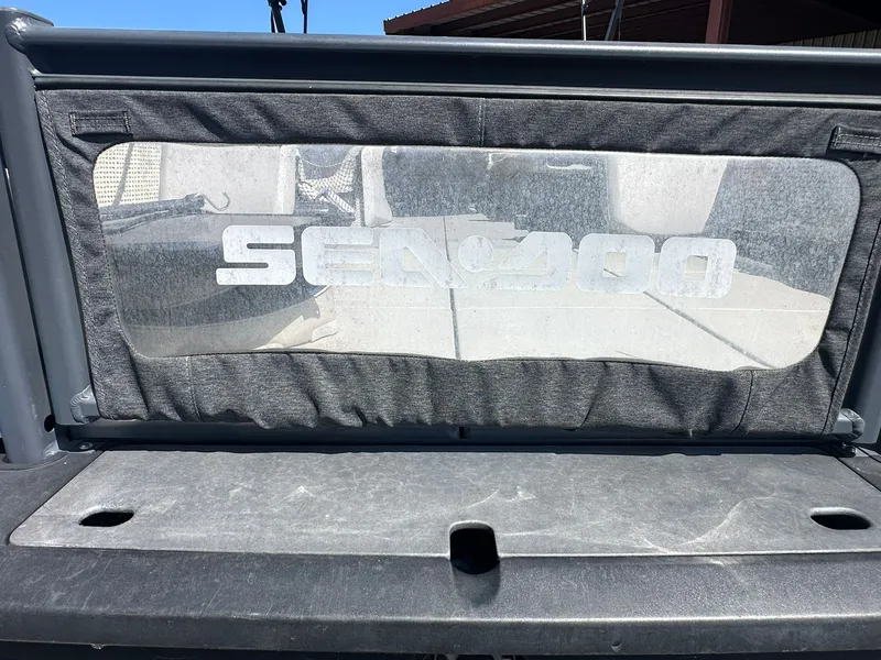 Slide: The Image of Rear view of a Sea-Doo 21 SWITCH SPORT with logo on the cover. - 35