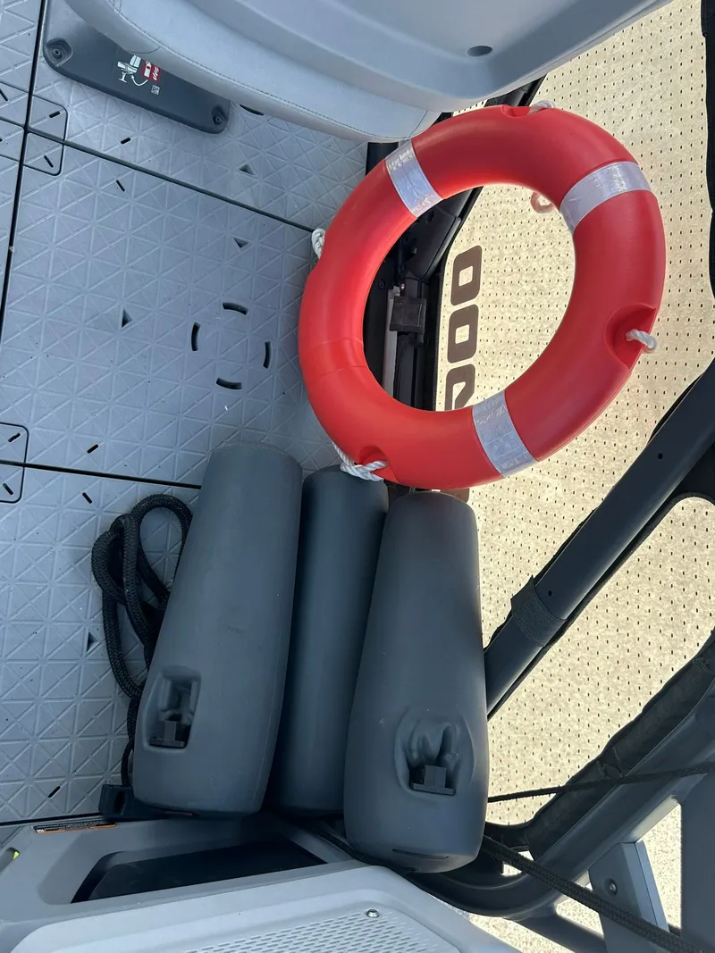 Slide: The Image of Lifebuoy and fenders on the floor of a Sea-Doo 21 SWITCH SPORT boat. - 38