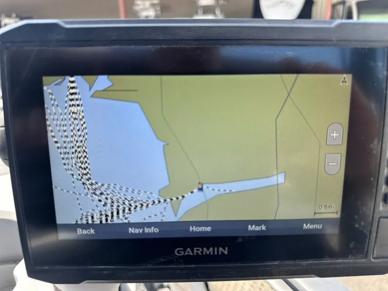 Slide: The Image of A Garmin navigation device displays a map with route tracking on a boat. - 47