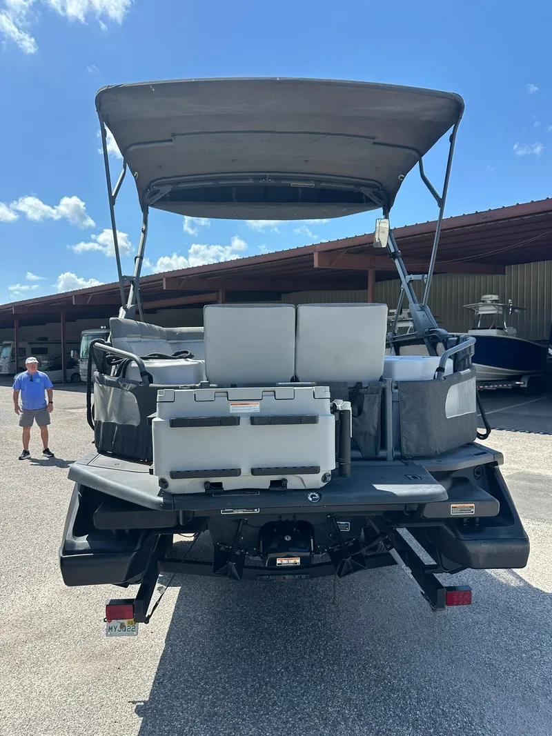 Slide: The Image of The image shows a 2023 Sea-Doo 21 SWITCH SPORT boat on a trailer. - 7