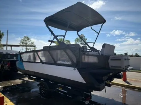 Slide: The Image of Sea-Doo 21 Switch Cruise 2023 on a trailer outdoors. - 8