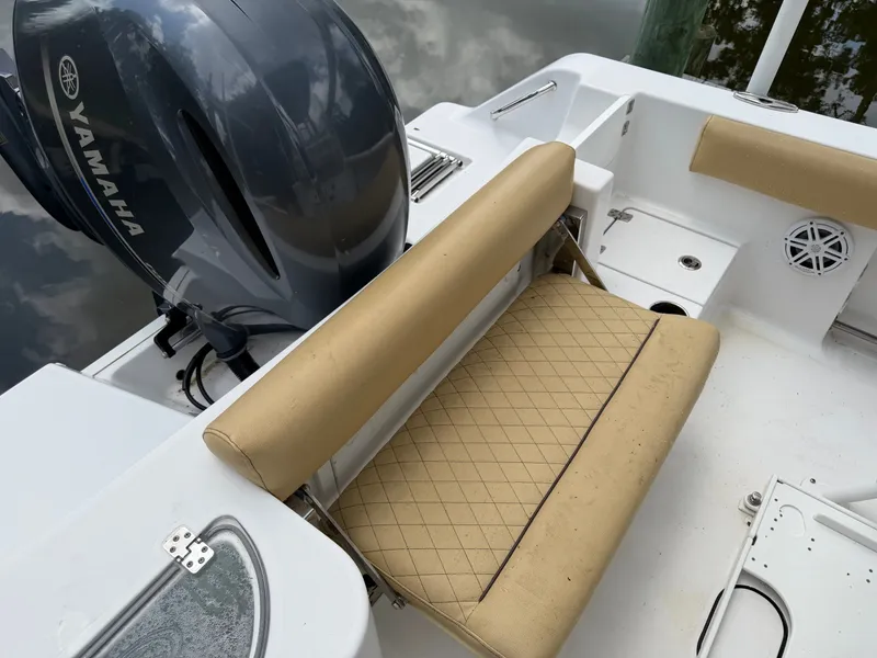 Slide: The Image of The image shows the cockpit of a 2021 Sportsman Heritage 211 Center Console boat. - 24