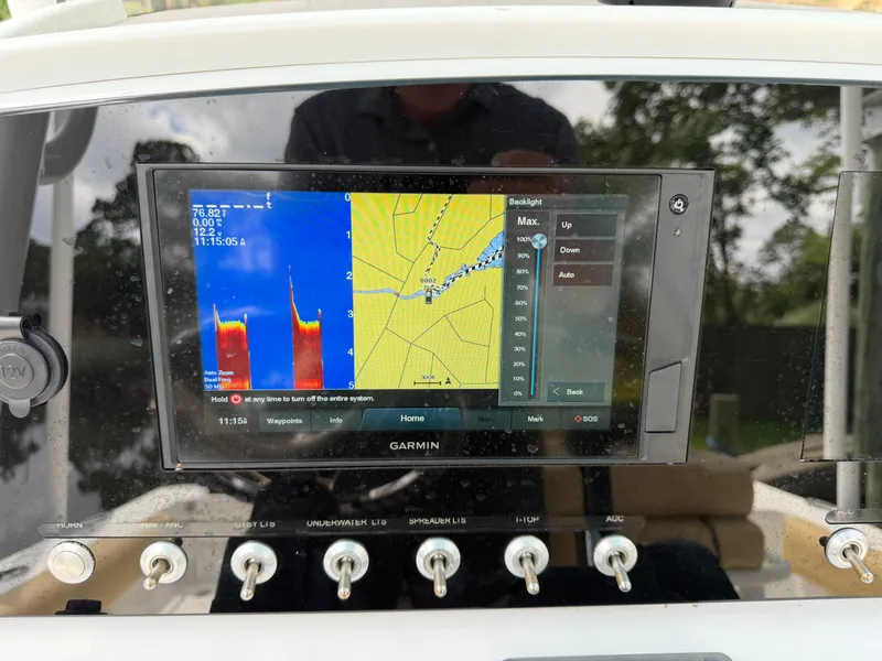 Slide: The Image of The image shows a Garmin navigation system on a boat. - 38