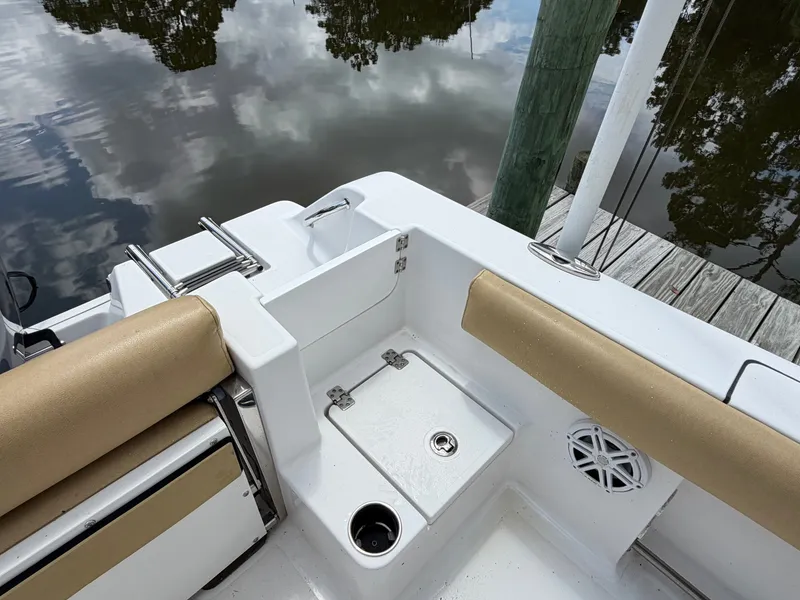 Slide: The Image of The image shows the cockpit of a 2021 Sportsman Heritage 211 Center Console boat. - 40