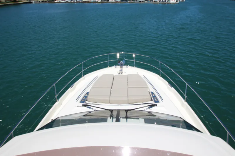 Slide: The Image of Prestige 520 yacht, 2022 model, cruising on serene blue waters. - 103