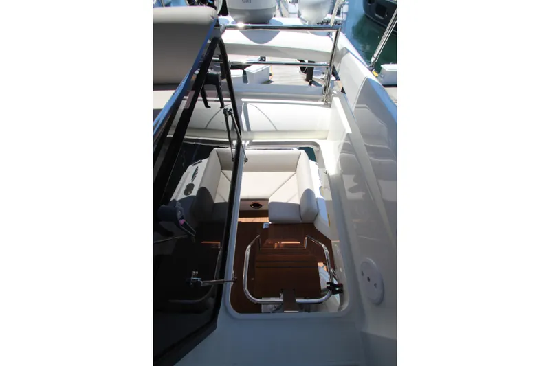 Slide: The Image of 2022 Prestige 520 yacht interior with seating and polished wood flooring. - 112