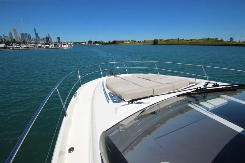 Slide: The Image of Prestige 520 yacht cruising near city skyline, 2022 model. - 120