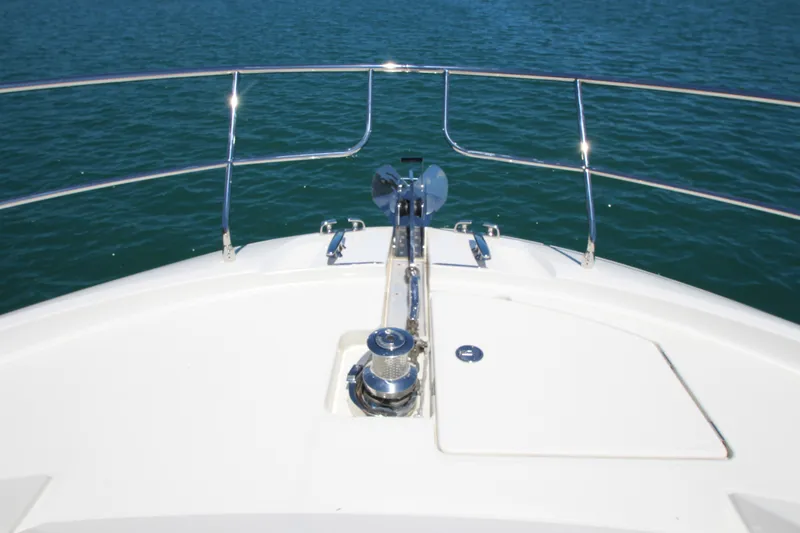 Slide: The Image of Bow of a 2022 Prestige 520 yacht with stainless steel railings on blue water. - 122