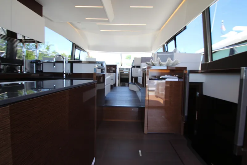Slide: The Image of Luxurious interior of a 2022 Prestige 520 yacht, featuring modern design and sleek finishes. - 13