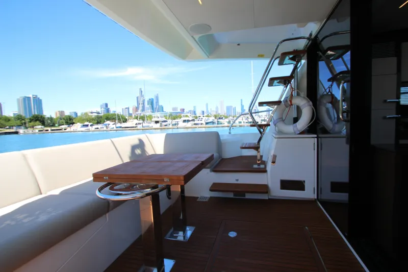 Slide: The Image of Luxurious 2022 Prestige 520 yacht deck with city skyline view. - 130