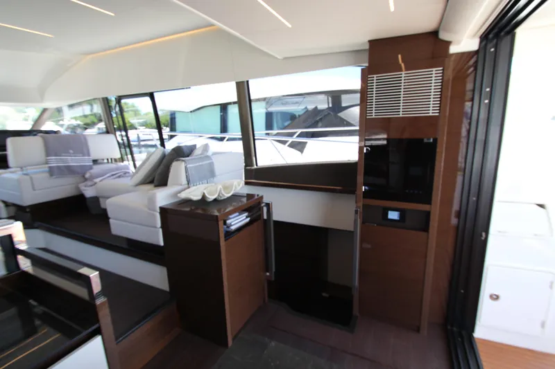 Slide: The Image of Luxurious interior of 2022 Prestige 520 yacht with modern seating and sleek design. - 17