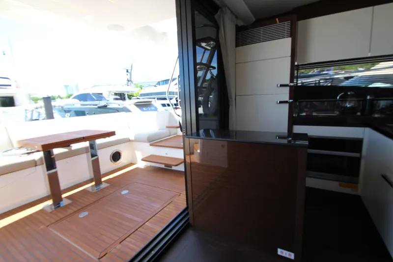 Slide: The Image of Luxurious interior of 2022 Prestige 520 yacht with modern seating and dining area. - 19