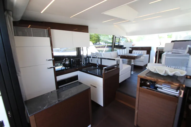 Slide: The Image of Modern interior of 2022 Prestige 520 yacht with sleek kitchen and comfortable seating area. - 20