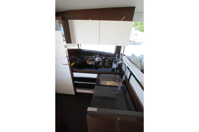 Slide: The Image of Modern kitchen interior of 2022 Prestige 520 yacht with sleek design and appliances. - 27