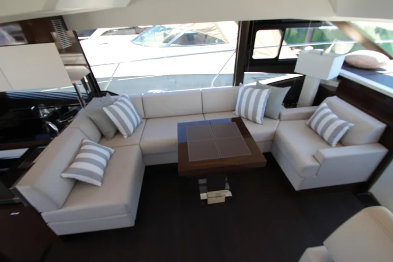 Slide: The Image of Luxurious interior of 2022 Prestige 520 yacht with elegant seating and striped cushions. - 32