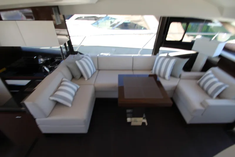 Slide: The Image of Luxurious interior of 2022 Prestige 520 yacht with elegant seating and striped cushions. - 33