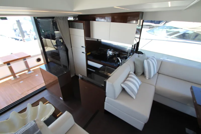 Slide: The Image of Luxurious interior of 2022 Prestige 520 yacht with modern kitchen and comfortable seating. - 35