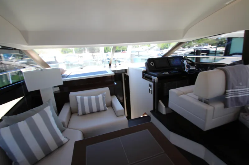 Slide: The Image of Luxurious interior of 2022 Prestige 520 yacht with modern seating and helm station. - 36