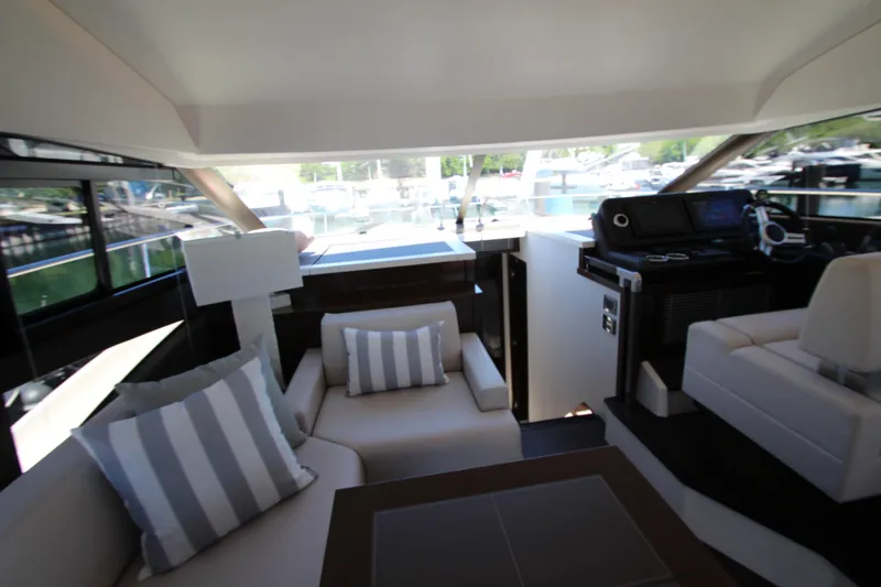 Slide: The Image of Luxurious interior of 2022 Prestige 520 yacht with plush seating and modern helm. - 37