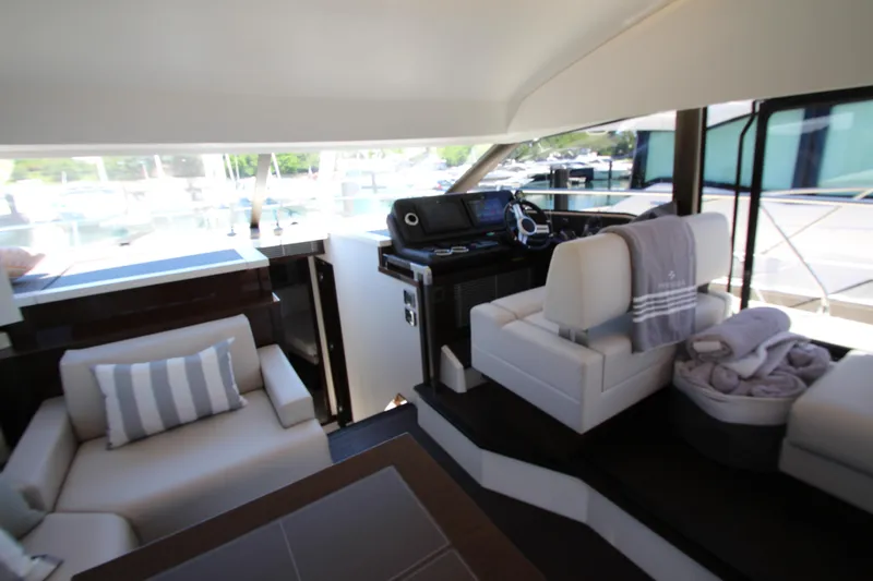 Slide: The Image of Luxurious interior of 2022 Prestige 520 yacht with modern seating and helm station. - 38