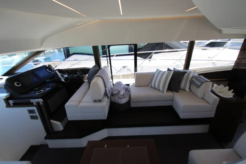 Slide: The Image of Luxurious interior of 2022 Prestige 520 yacht with modern seating and helm station. - 39