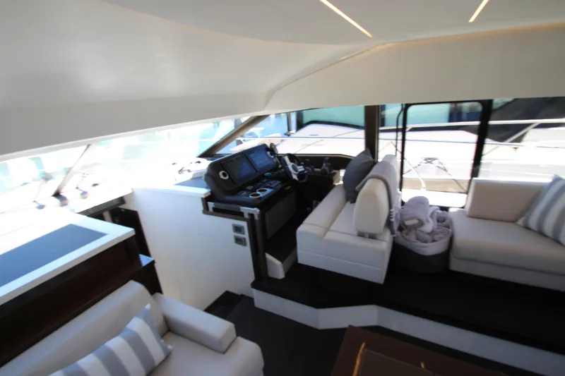 Slide: The Image of Luxurious interior of 2022 Prestige 520 yacht with modern helm and seating area. - 40