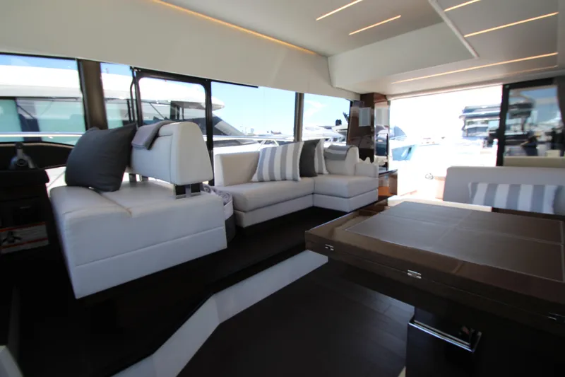 Slide: The Image of Luxurious interior of 2022 Prestige 520 yacht with modern seating and elegant decor. - 42